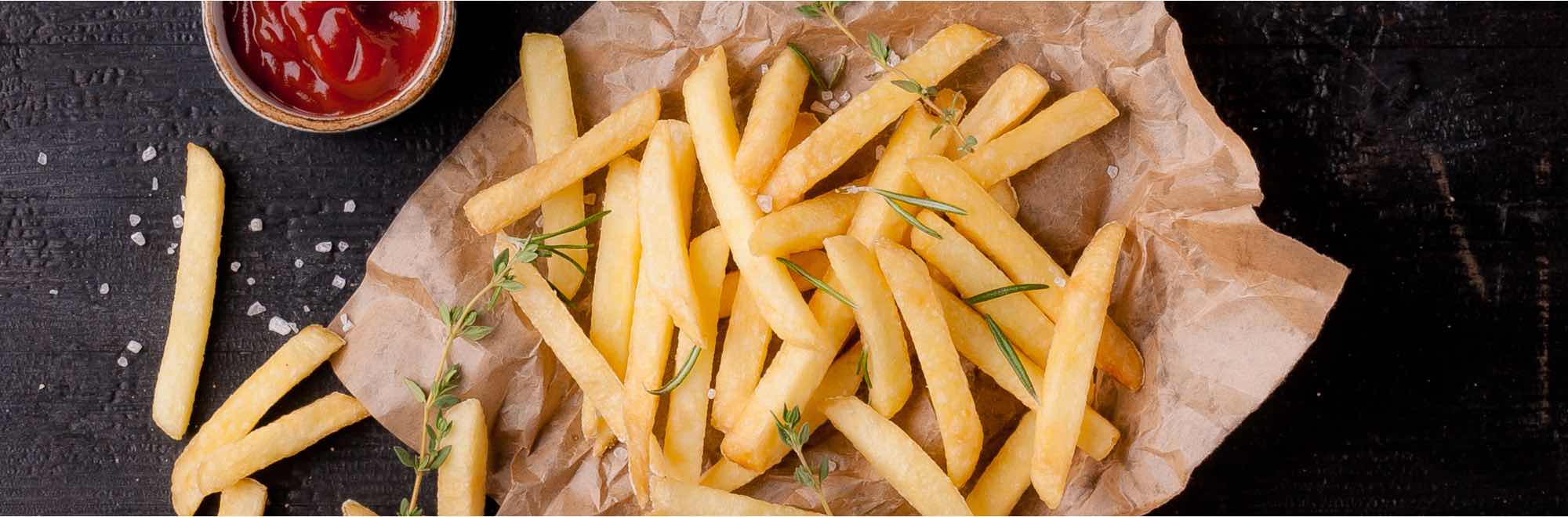 Crispy hot chips on a bed of paper